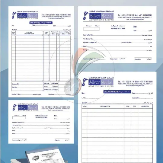  A collection of business forms, receipts, and letterhead arranged neatly on a surface, showcasing professional documentation.