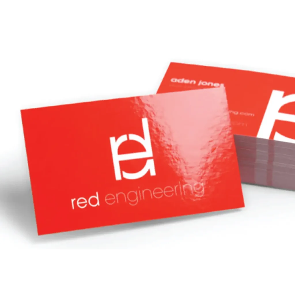 Matte laminated red business cards for an engineering firm, featuring rounded corners and a sturdy 400 GSM weight